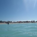 View of the beach from the ocean.